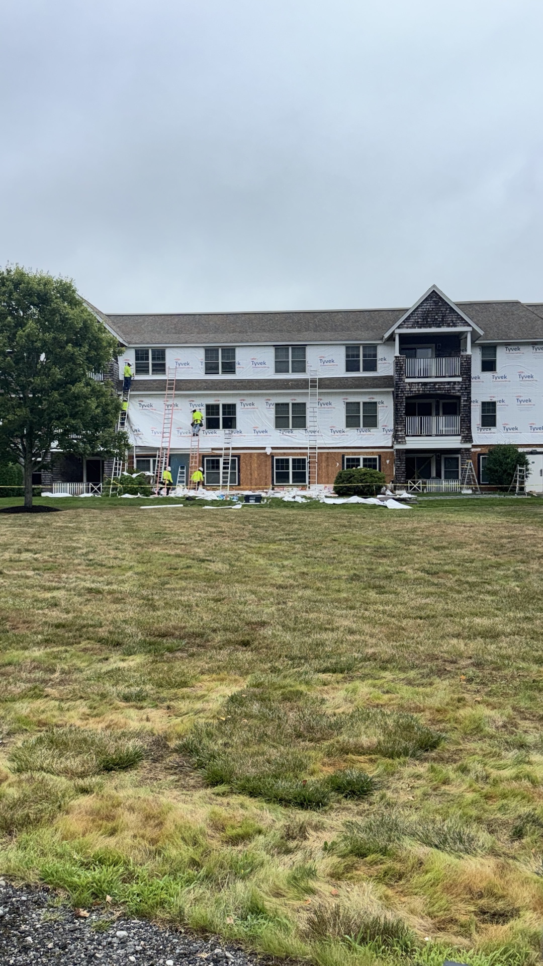 3-story multi-unit re-side — Tyvek wrap